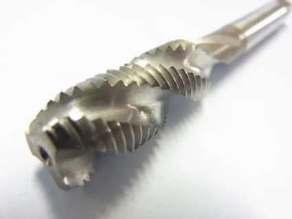 Close-up of a spiral-flute tap tool