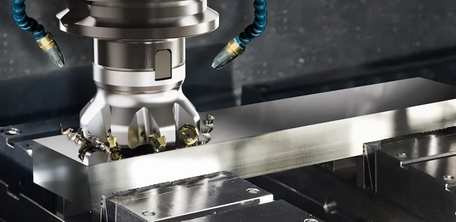 Face milling cutter removing material from a metal workpiece