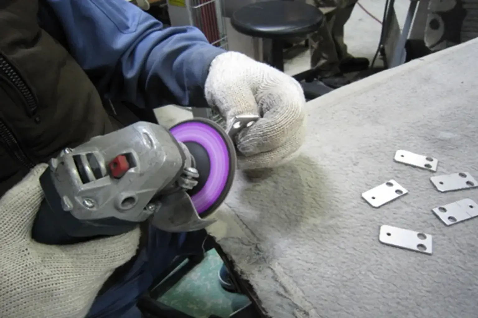 Deburring a cut sheet metal part