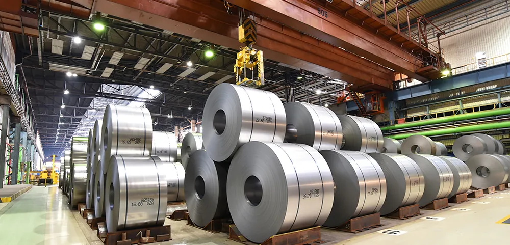 Stacked SECC and SGCC zinc-plated steel sheets in a manufacturing environment